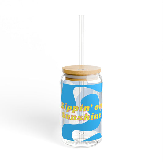 Clear tumbler with blue design and yellow text