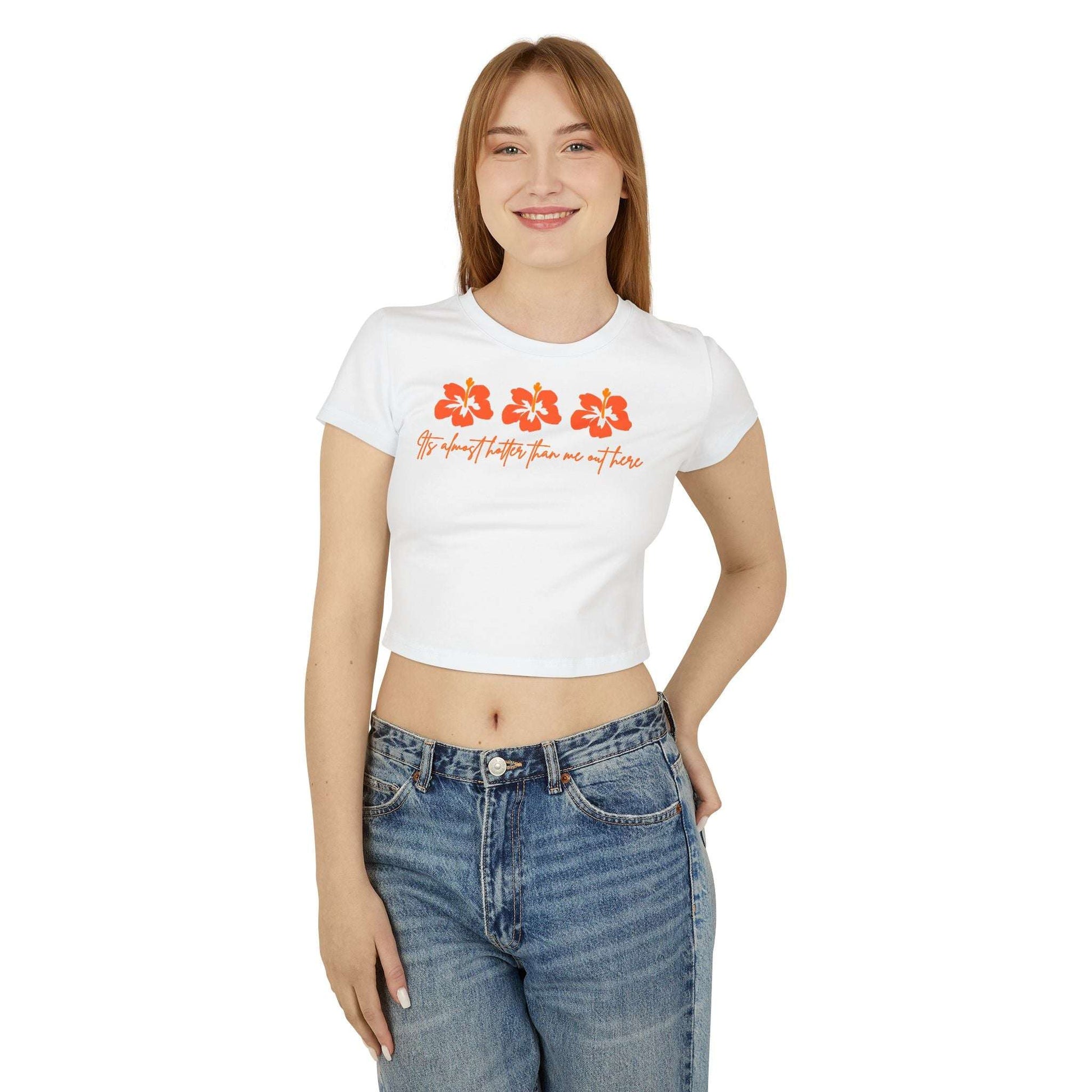 Woman wearing a white t-shirt with floral designs and text